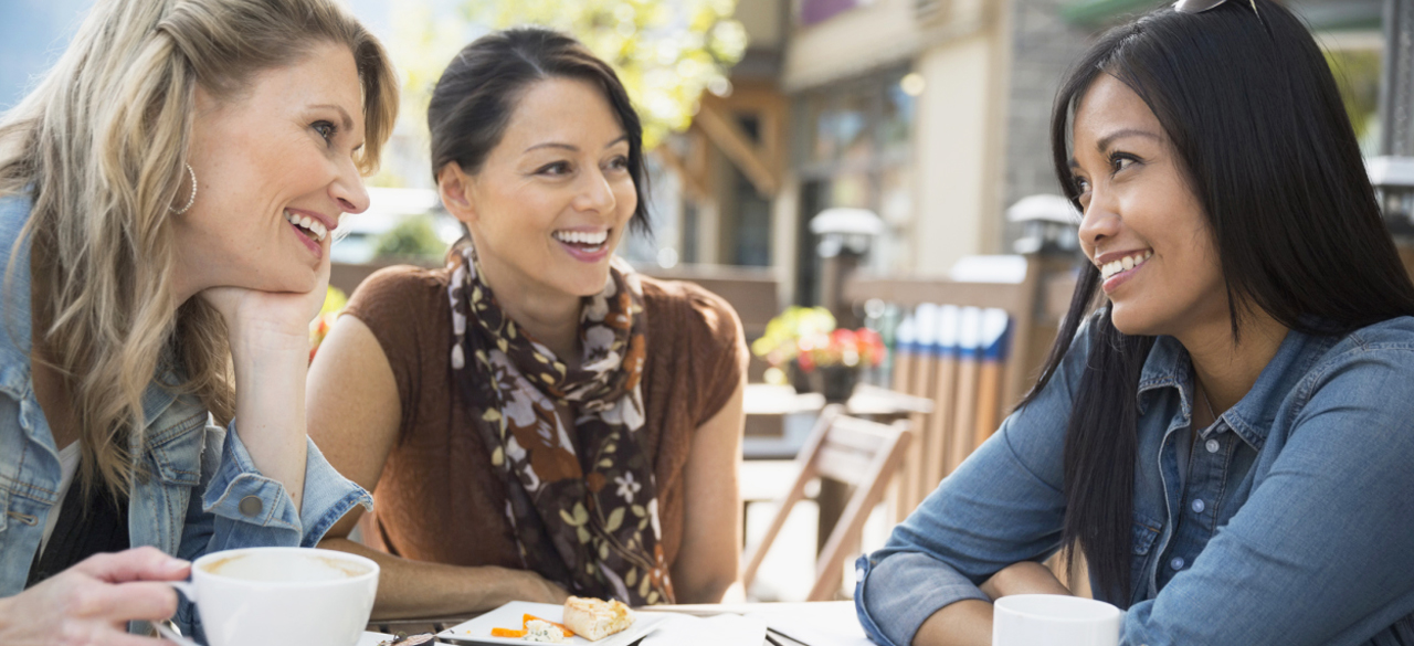 Three women sitting at coffee shop