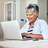 Older woman looking at a laptop